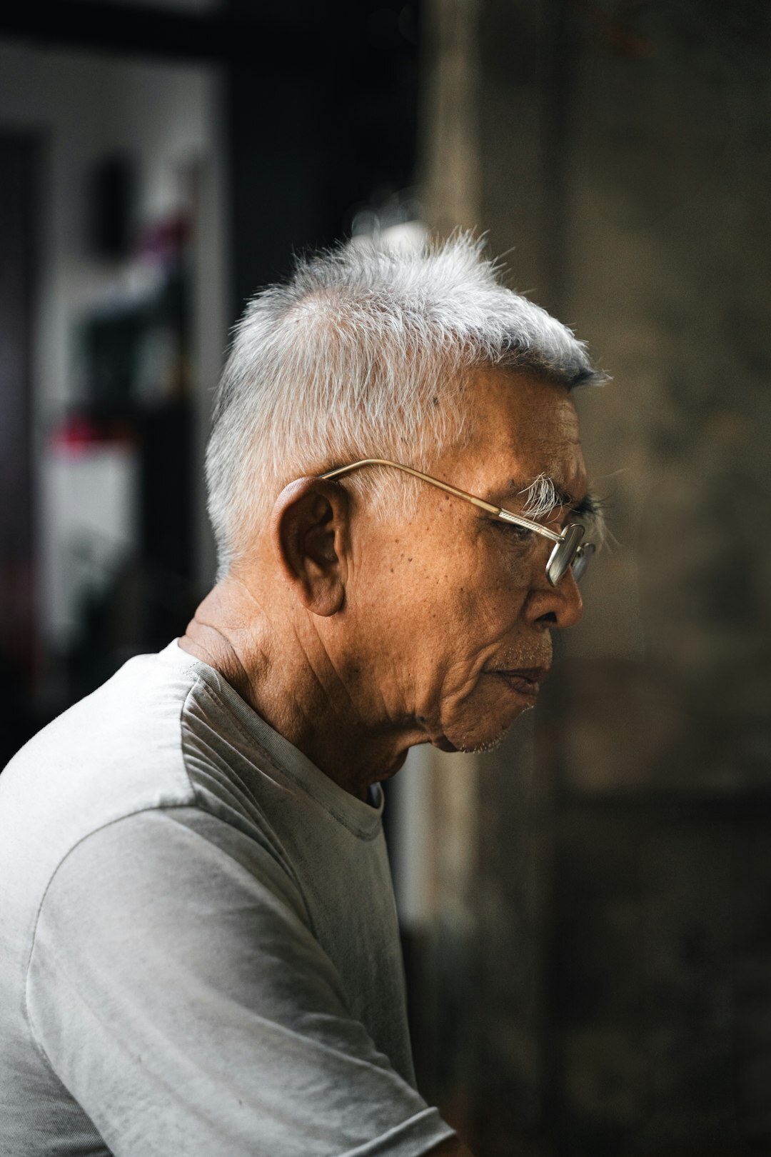 Studio portrait of a Swiss man in his fifties with glasses